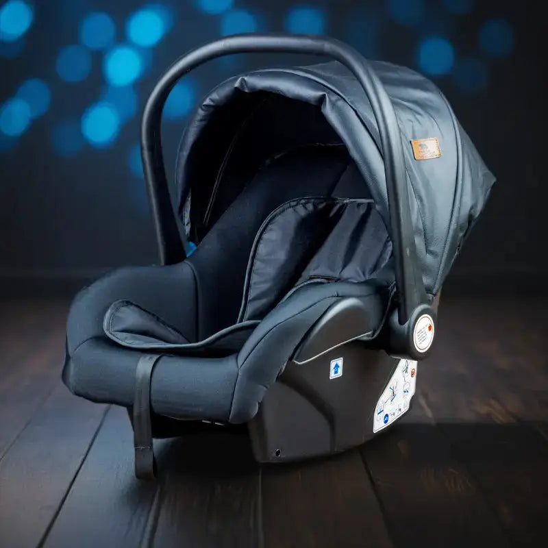 Black Lucid SENA infant car seat shown against a blue backdrop