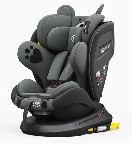 Kidilo 946: dark grey car seat three-quarter view with padded headrest, harness and yellow ISOFIX connectors.