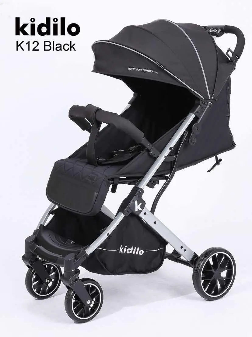 Kidilo K12G: Black stroller in three-quarter view with extended canopy, front bar and lower basket.