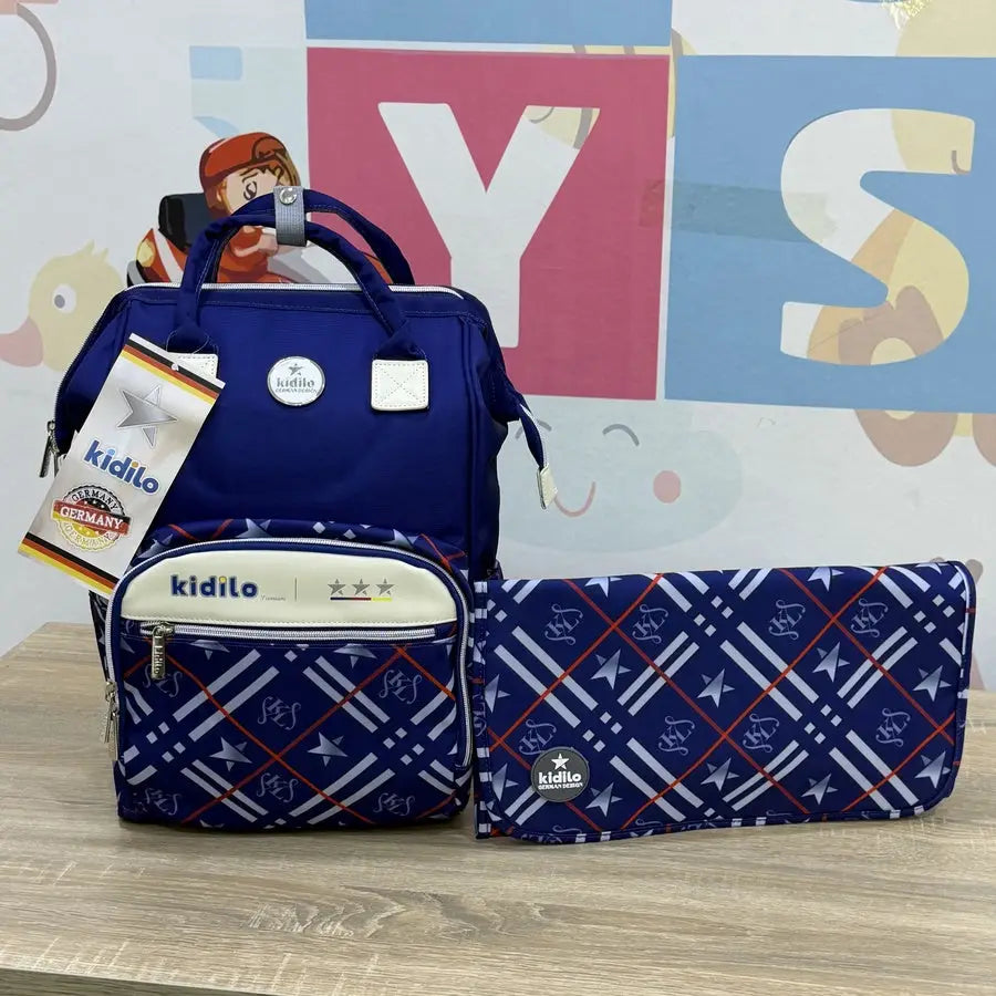 Kidilo Plaid-Print: blue front view beside plaid changing mat on wooden table.