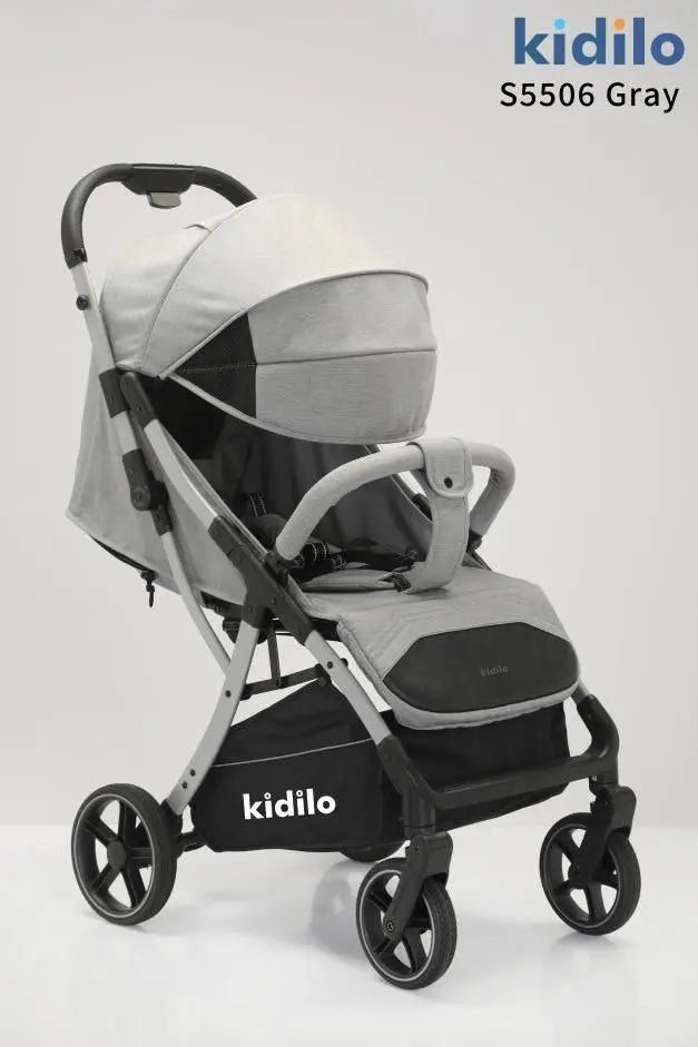 Kidilo S5506: Grey stroller in three-quarter view with front bar, canopy and silver-toned frame.