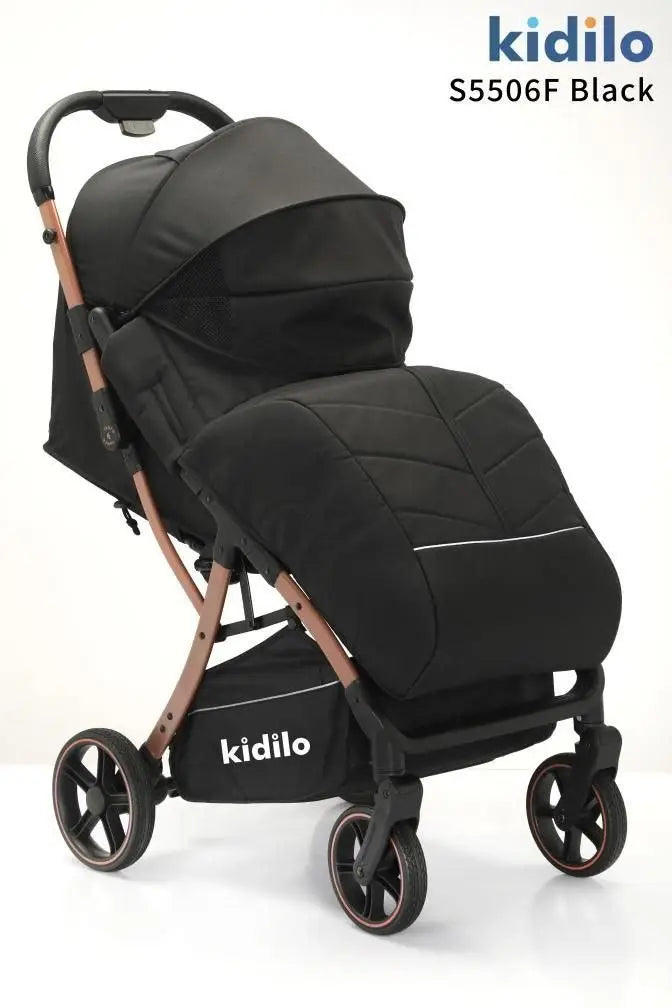 Kidilo S5506F: Black stroller in three-quarter view with quilted leg cover and copper-toned frame.