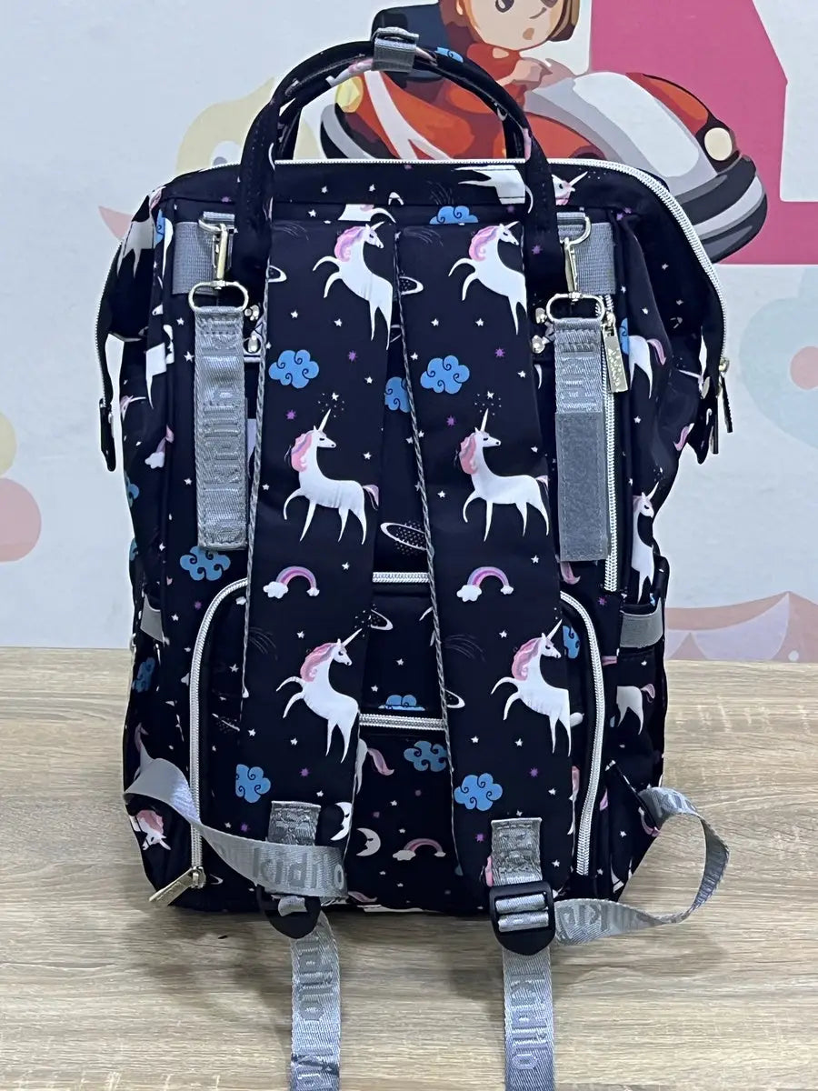 Kidilo Unicorn-Print: dark unicorn-print backpack rear view with padded straps and grey loops.