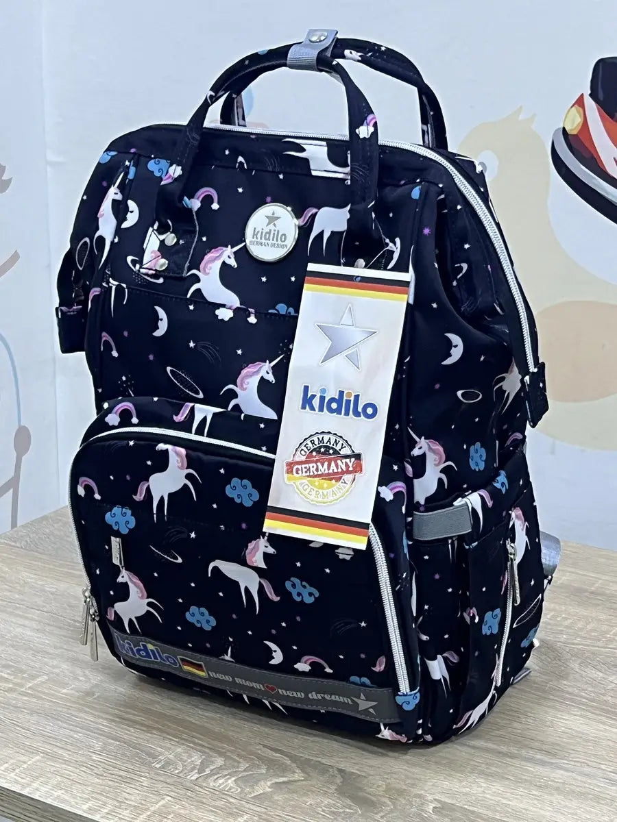 Kidilo Unicorn-Print: navy front view on wooden surface with patterned front pocket.
