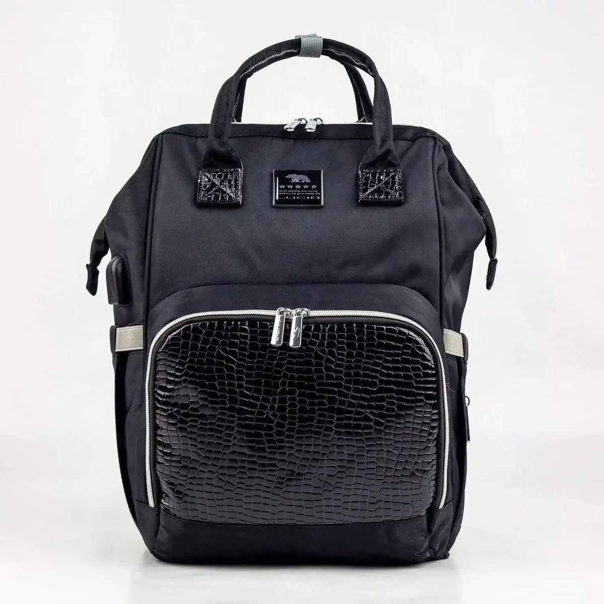 Lucid diaper backpack – black backpack front view with textured zipped pocket and twin handles