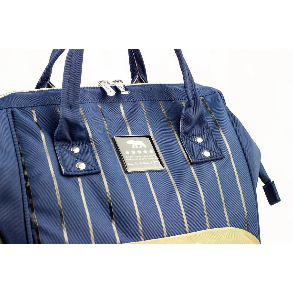 Lucid diaper backpack – upper front detail of navy stripes, handles and Lucid label