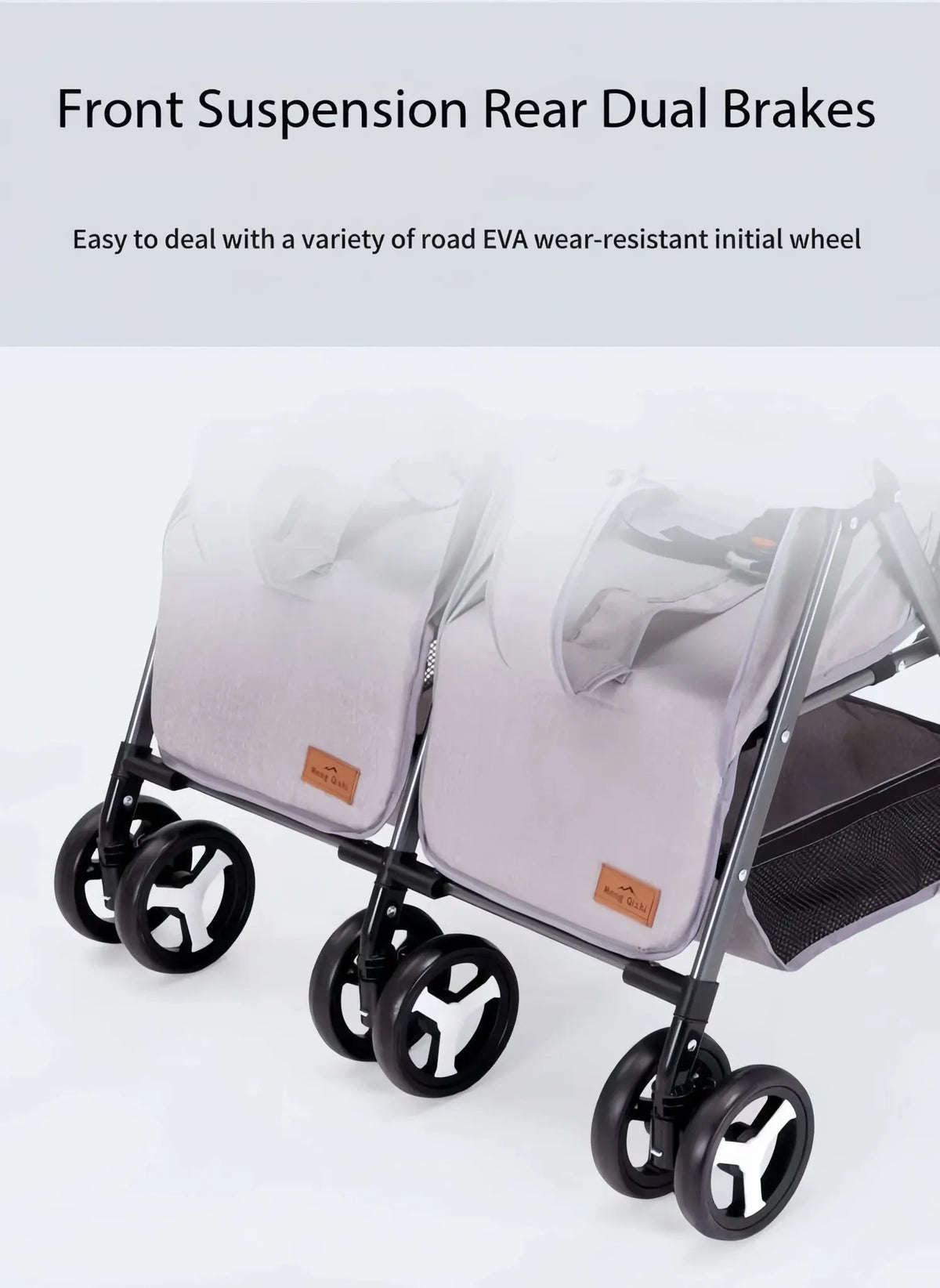 Lucid SWIVEL LC6: Grey twin stroller wheel close-up with suspension and rear brake graphic