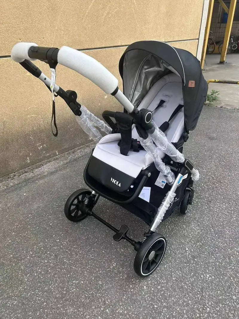 Lucid VIOLA LC8: Black stroller with grey padded insert, angled front view