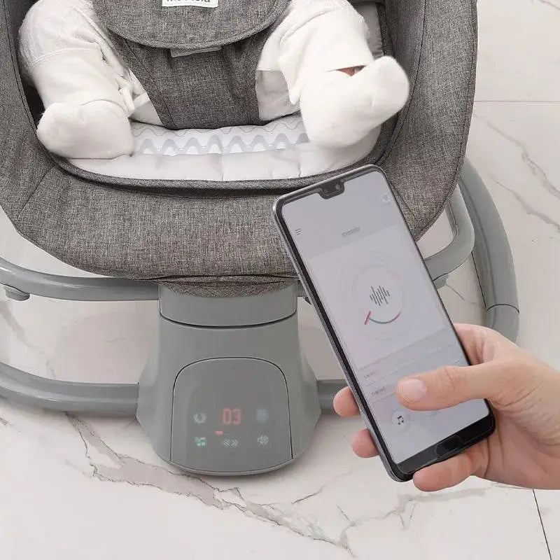 Mastela 4-in-1: close-up of grey swing control panel beside a smartphone control screen.