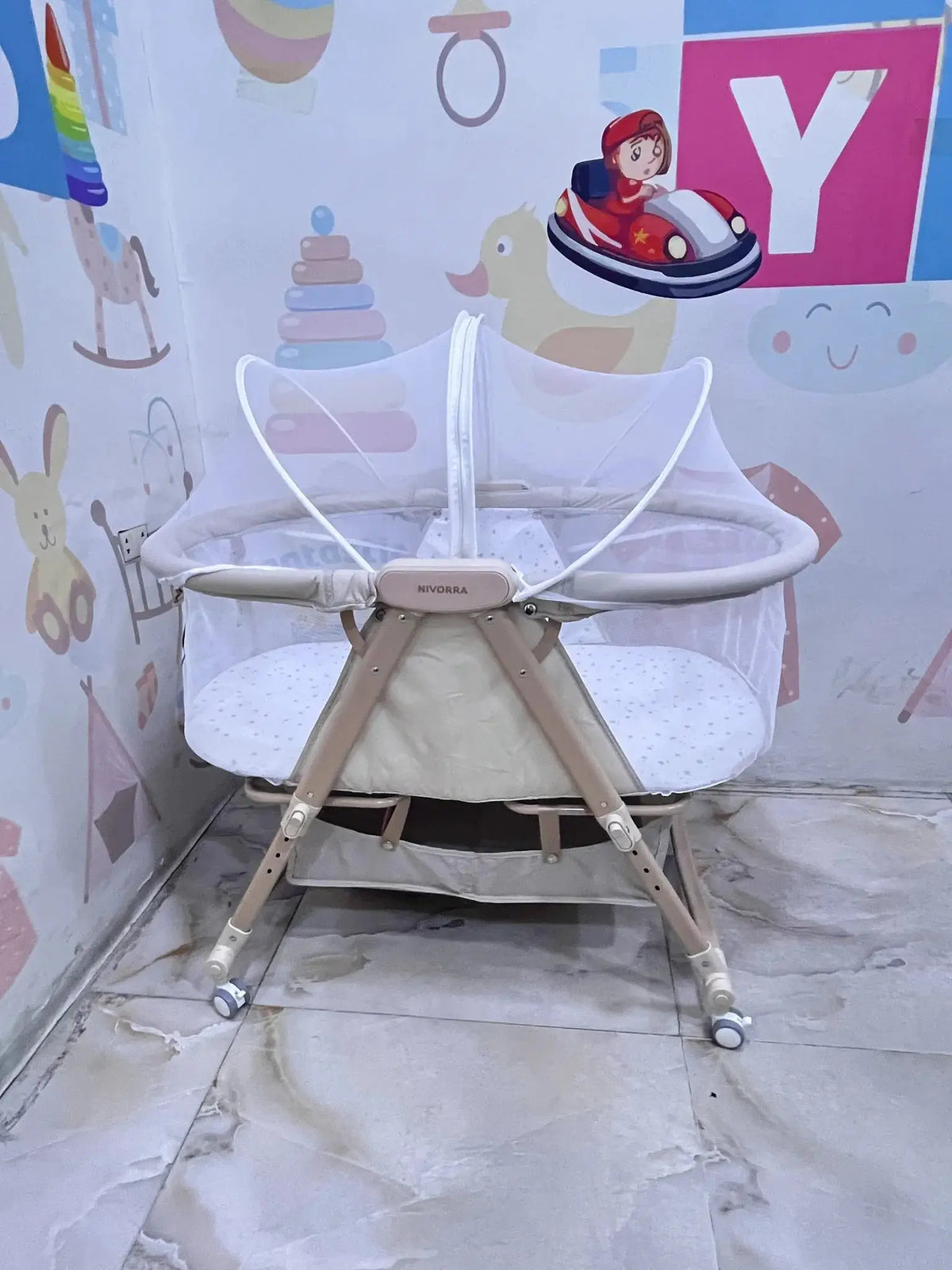 Nivorra NB-3F: beige bassinet side angle in showroom with white net raised.