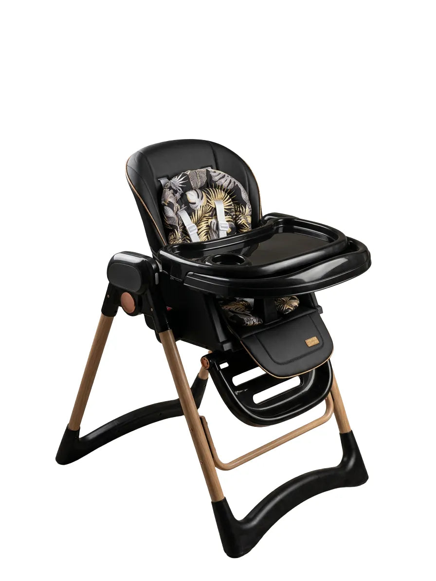 Umbrella X17 Pro: black high chair with leaf-print seat insert, tray and gold-coloured legs.